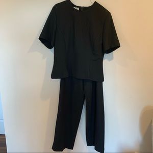 Two piece black suit, trouser, short sleeve shirt